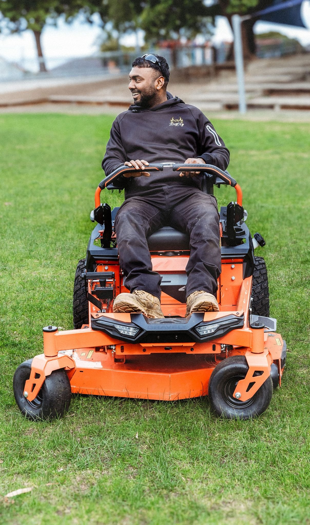 FreyJay Garden team on ride-on mower Melbourne lawn mowing